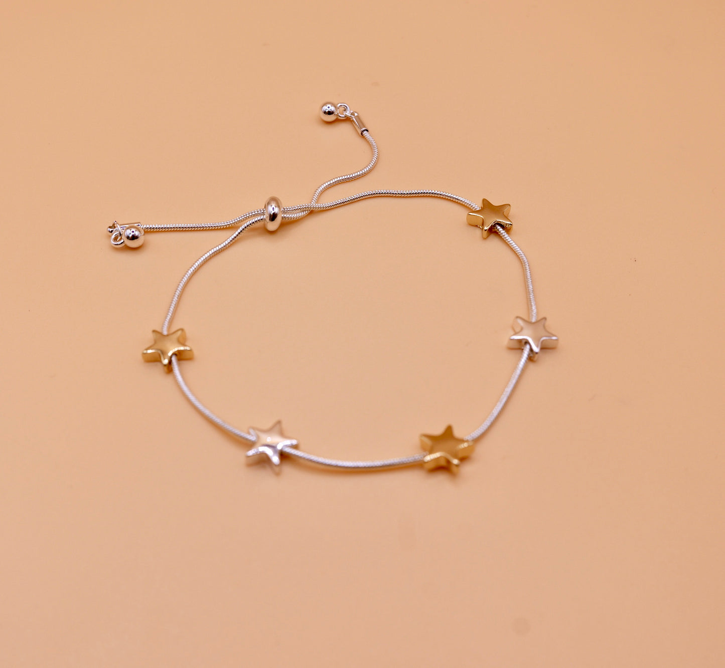 Gold and silver star bracelet in silver