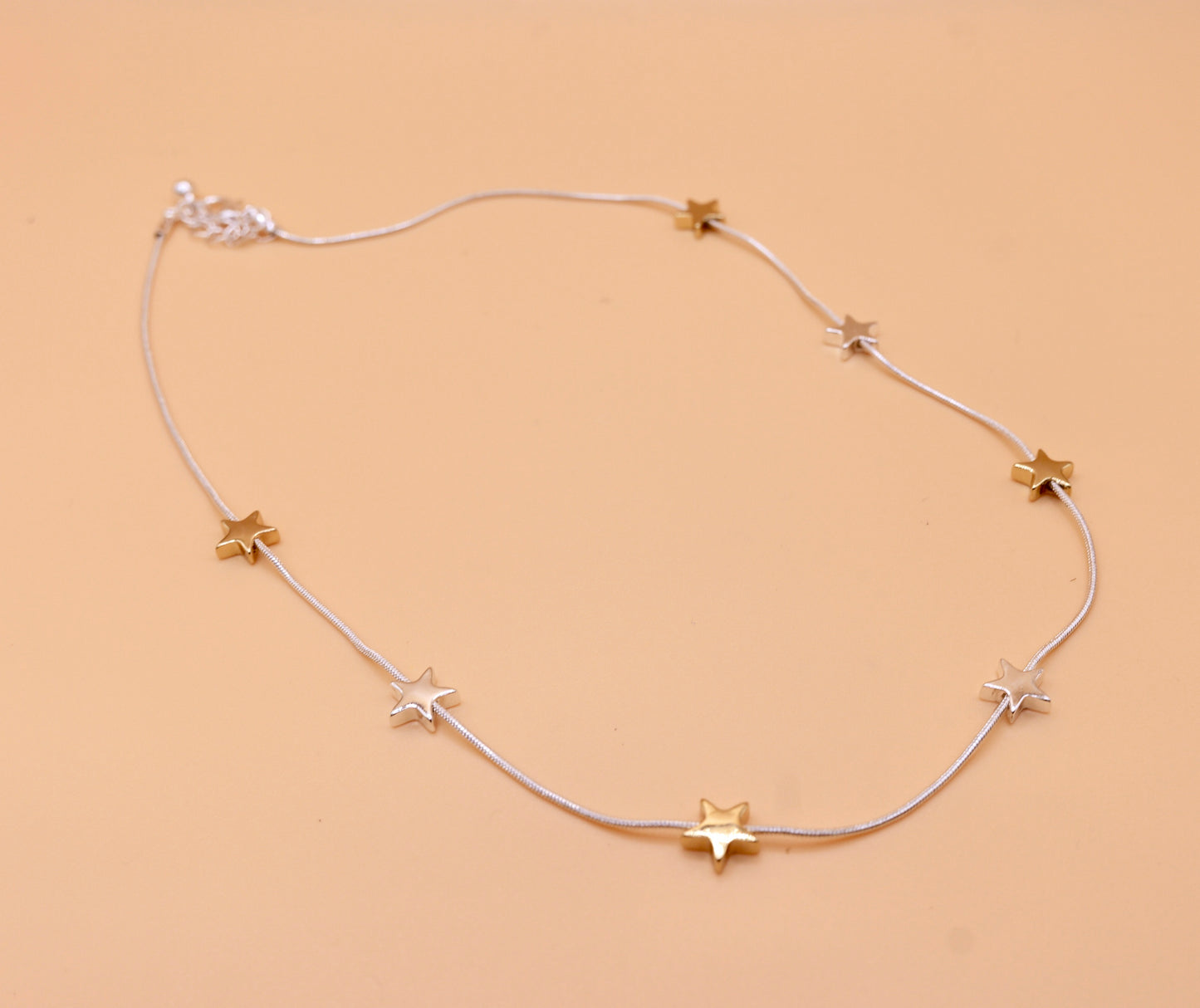 Star gold and silver charm necklace
