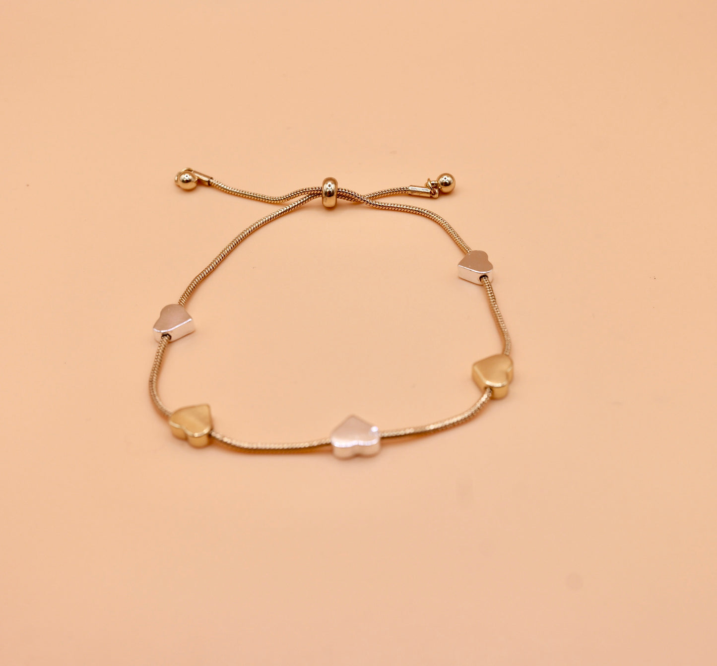 Gold and silver heart bracelet in gold