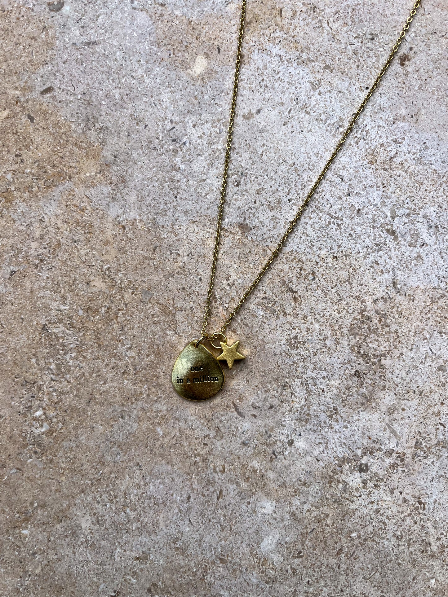 "One in a million" gold charm necklace