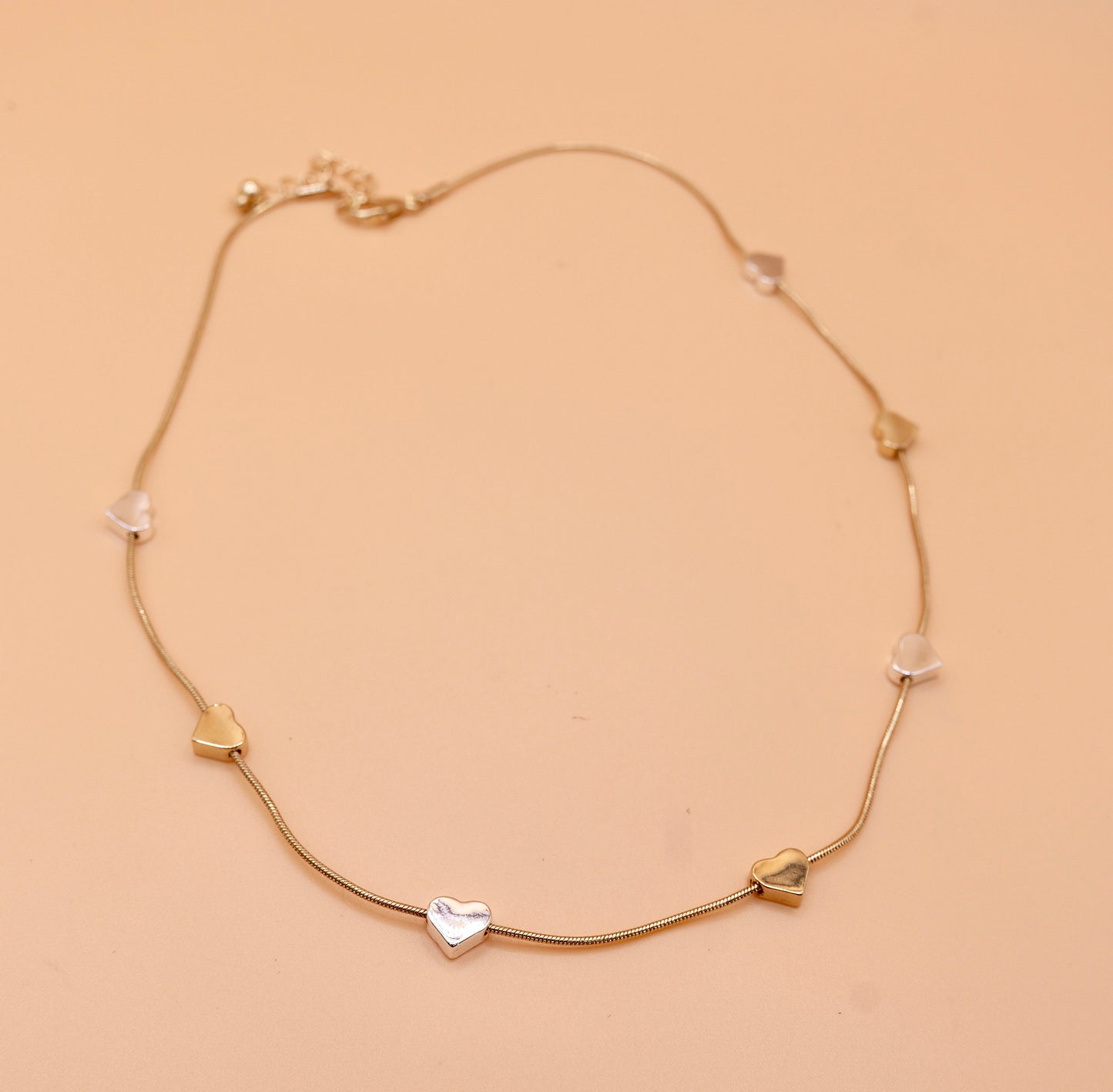 Heart gold and silver charm necklace