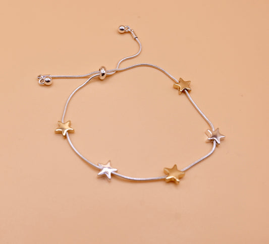 Gold and silver star bracelet in silver