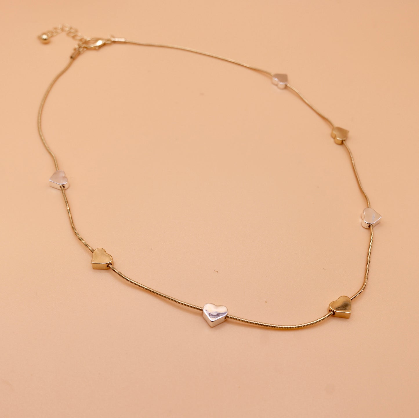 Heart gold and silver charm necklace