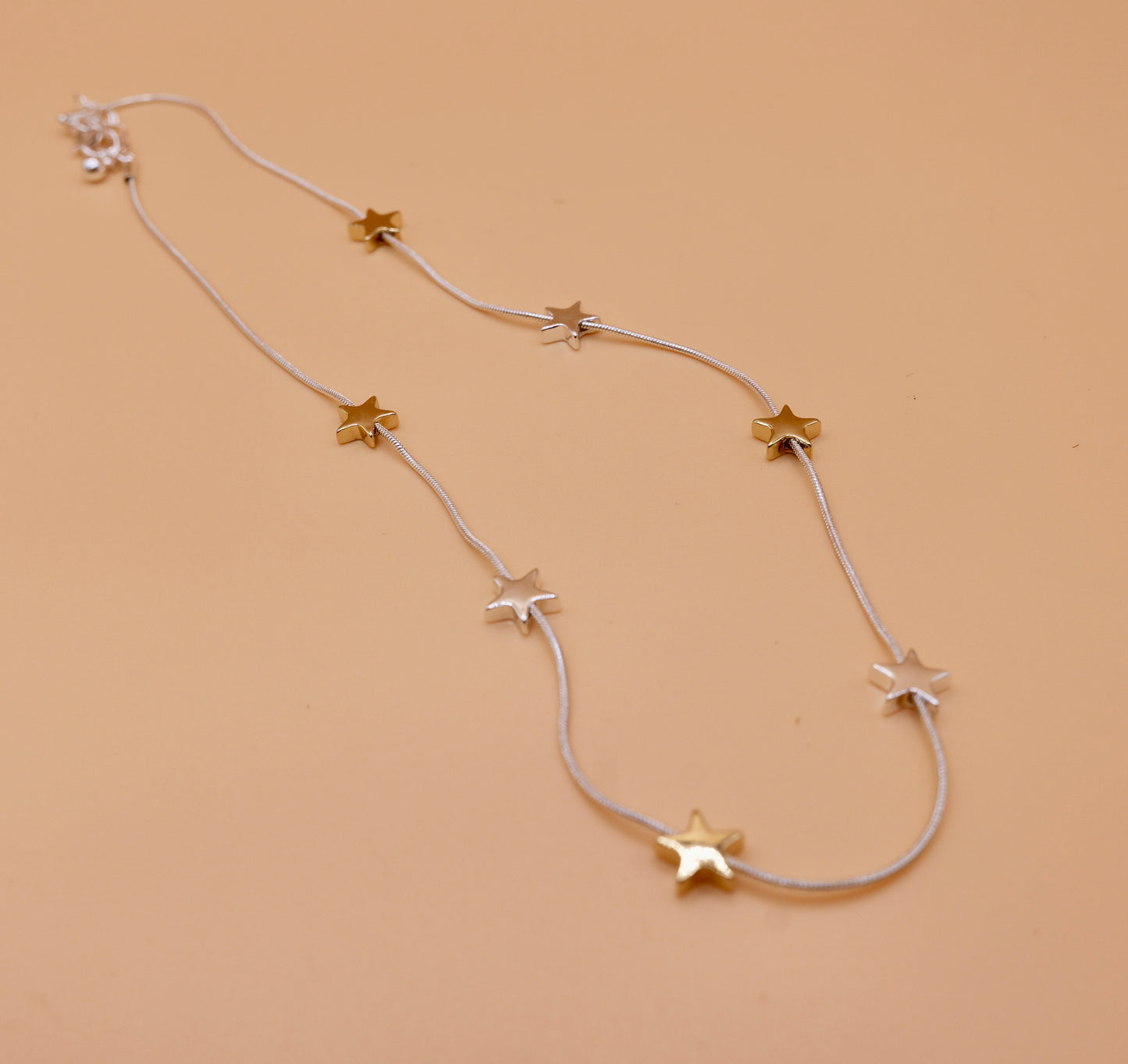 Star gold and silver charm necklace