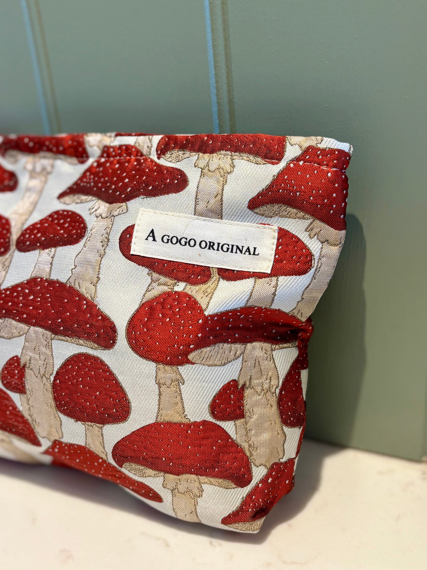 Mushroom makeup bag in red