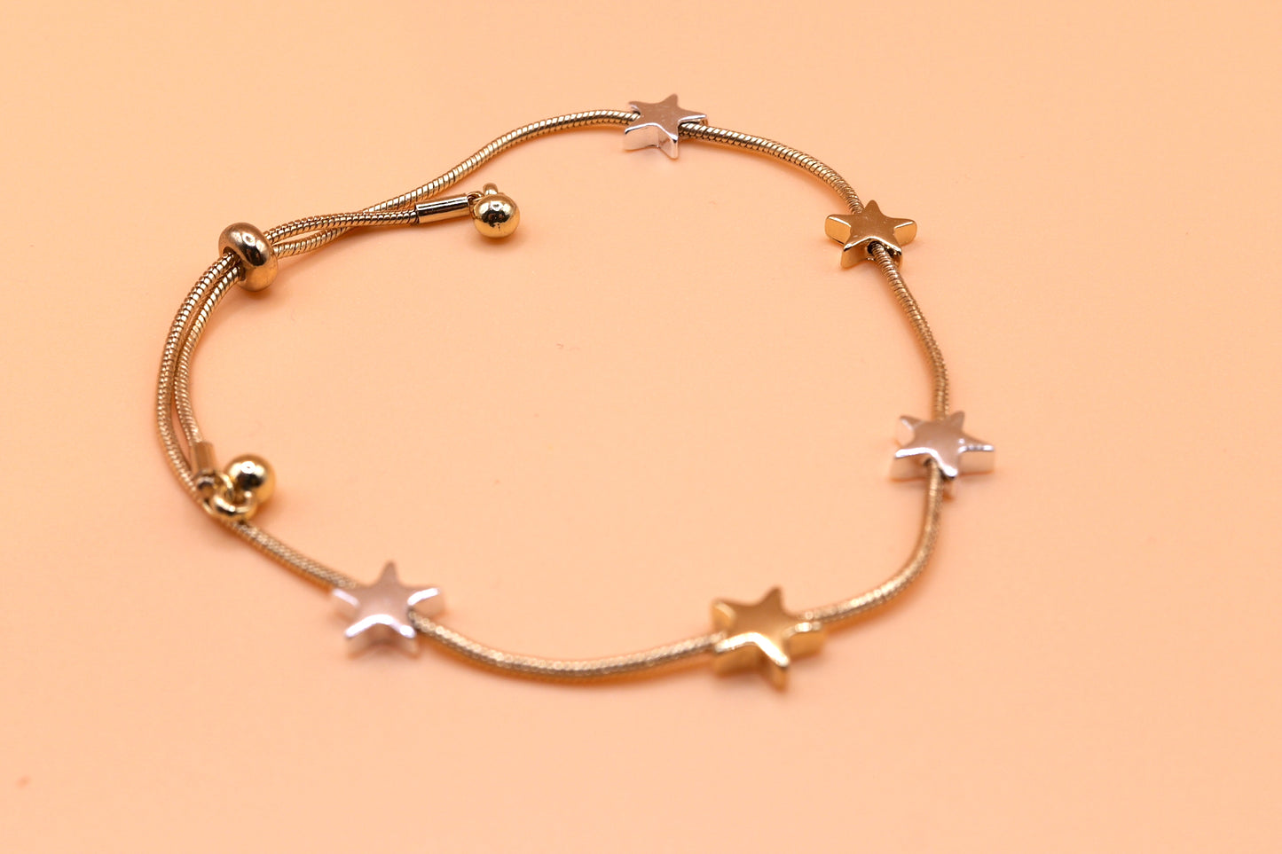 Gold and silver star bracelet in gold