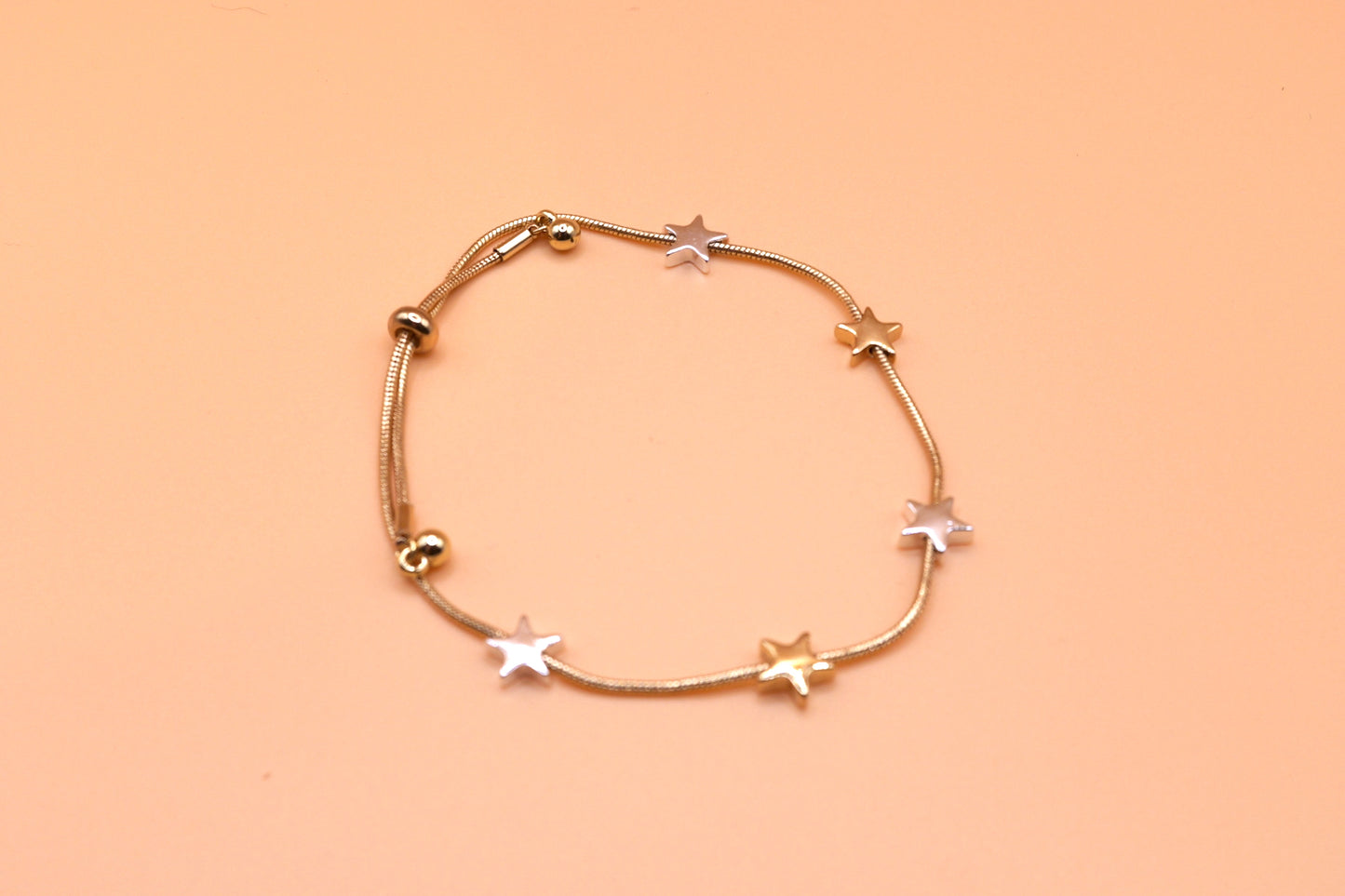 Gold and silver star bracelet in gold